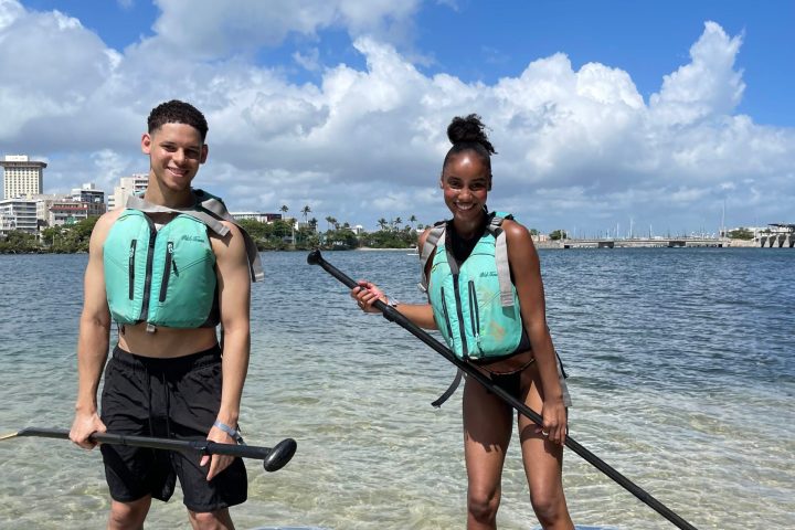 a group of people that are standing in the water